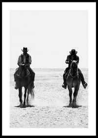 Two cowboys ride side by side through a desolate landscape, framed by the timeless mystery and freedom of the Wild West.-0