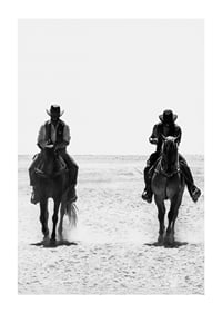 Two cowboys ride side by side through a desolate landscape, framed by the timeless mystery and freedom of the Wild West.-1