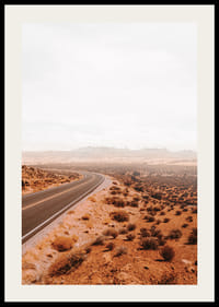 A winding road through the desert landscape that beckons with promises of adventure and freedom on the horizon.-2