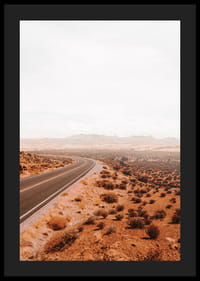 A winding road through the desert landscape that beckons with promises of adventure and freedom on the horizon.-4