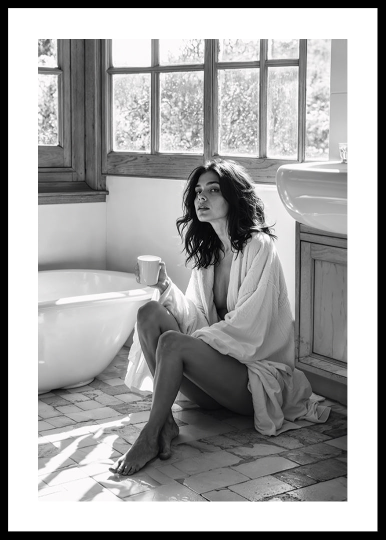 A woman sits in her bathroom with her morning cup and thinks-12