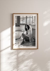 A woman sits in her bathroom with her morning cup and thinks-8