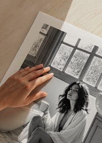 A woman sits in her bathroom with her morning cup and thinks-9