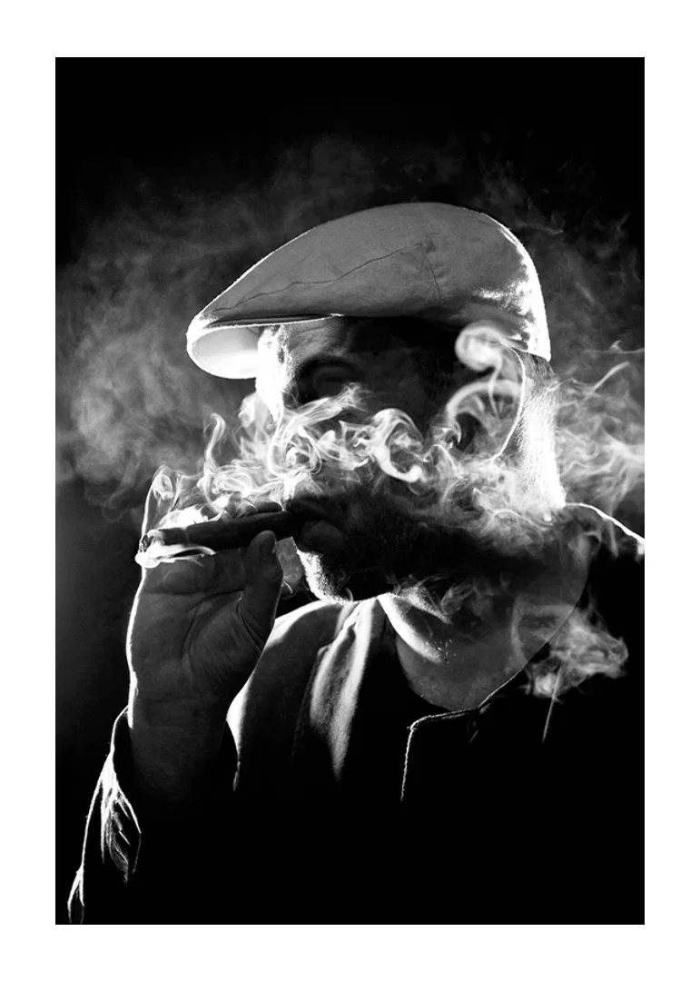 Black and white poster with a photograph of a man in shadows and smoke-12