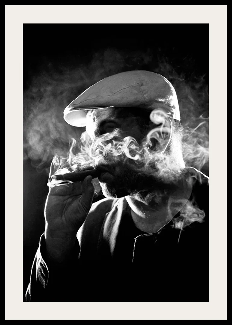Black and white poster with a photograph of a man in shadows and smoke-12