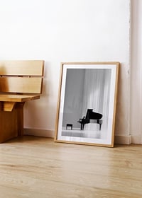 Black and white poster with a photograph of an elegant piano-8