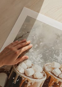 A winter poster with two cups of hot chocolate and marshmallows in a snowy setting.-9