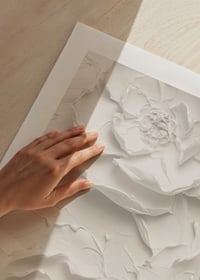 A poster with textured, detailed flowers in soft, monochrome tones-9
