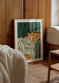 A poster of a relaxed orange cat resting on a striped blanket-4