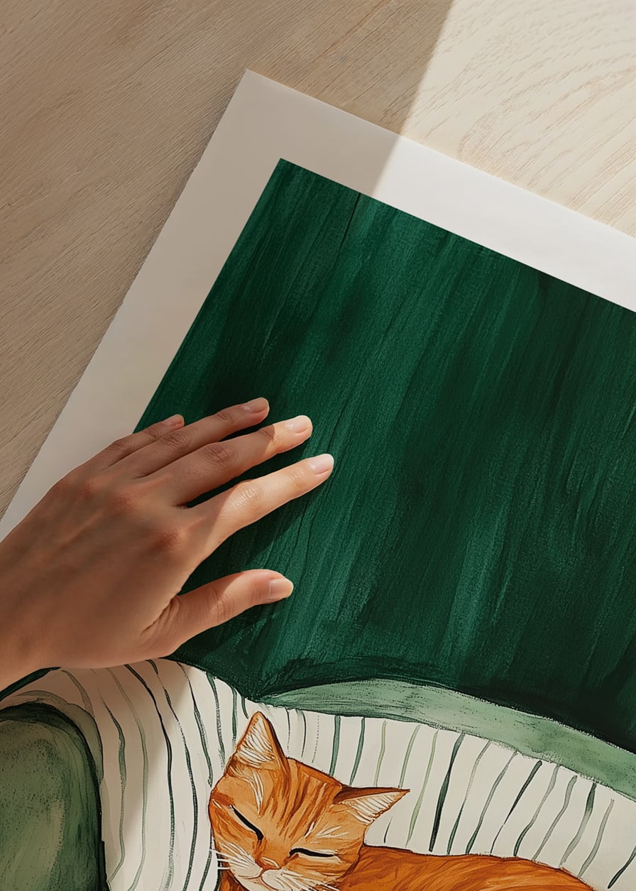 A poster with a sleeping orange cat on a striped blanket in a green armchair-12