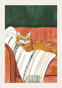 Une affiche d'un chat orange reposant sur une couverture rayée dans un fauteuil rouge rouille-3