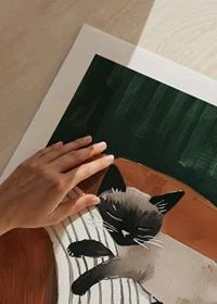An elegant poster of a Siamese cat sleeping on a striped pillow-9