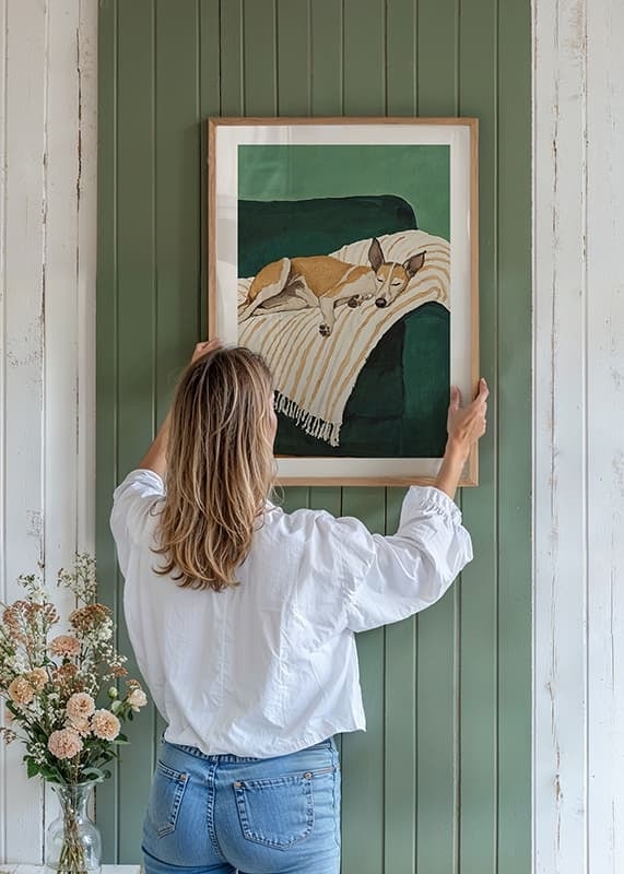 En poster av en sovande hund på en randig filt-12
