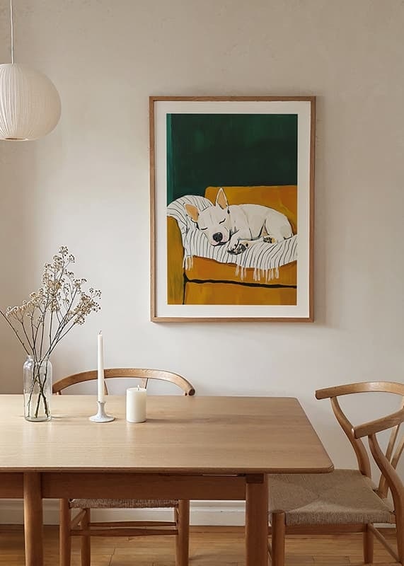 A poster of a sleeping white dog on a striped blanket-12