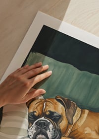 A poster of a sleeping boxer on a striped pillow-9