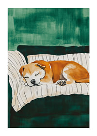 A poster of a sleeping dog on a striped blanket-1