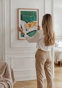 A poster of a sleeping dog on a striped pillow-4