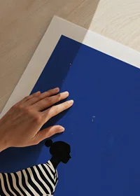 A poster of a figure in a striped suit that creates a calm feeling in your home-9