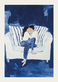 A poster capturing an intimate moment of a couple in a warm embrace on the couch-3