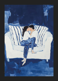 A poster capturing an intimate moment of a couple in a warm embrace on the couch-5
