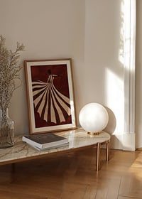 A poster depicting a stylized figure in a flowing striped dress against a deep red background-8