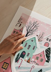 A poster of a colorful winter village with snow-covered houses and Christmas decorations in pastel tones-9