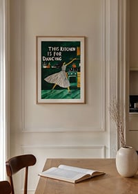 A poster of a dancing woman in the kitchen-8