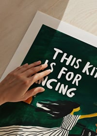 A poster of a dancing woman in the kitchen-9