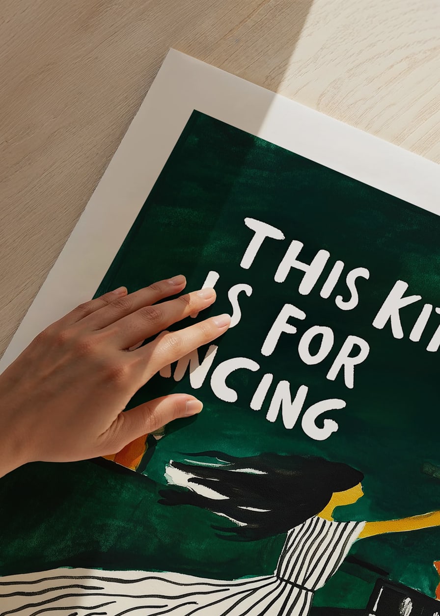 A poster of a dancing woman in the kitchen-12