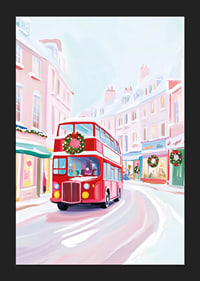 A poster of a red double-decker bus driving through a snowy, Christmas-decorated city-5