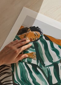  A poster of a woman resting on a sofa-9