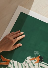 A poster of a relaxed woman on a striped sofa smoking a cigarette-9