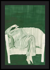 A poster of a person in striped clothes matching the sofa-4