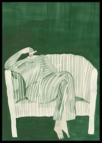 A poster of a person in striped clothes matching the sofa-6