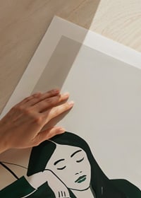 A poster depicting a woman in deep rest, wrapped in soft green tones-9