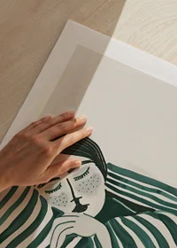 A poster depicting a person wrapped in a striped blanket, resting in deep stillness-9