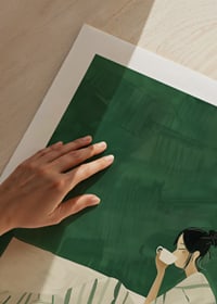 A poster depicting a woman wrapped in a striped blanket, enjoying a hot cup of-9