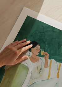 A poster depicting a woman in relaxed luxury, enjoying a glass of wine-9