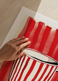 Captivating red and white mug against vibrant striped background pattern-9