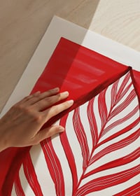 A bold leaf motif in red contrast creates vibrant energy-9