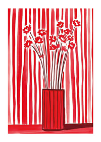 Flowers in vase captured against dynamic red-and-white striped background-1