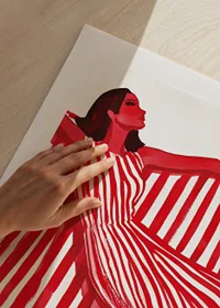 A vibrant woman in a red and white striped dress exudes cheerful elegance-9