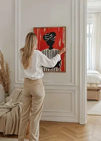 Black and white silhouette motif with book, against a bold red background-8