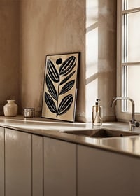 Bold, abstract leaves in dark tones give a modern feel against a beige background-8