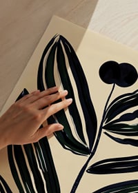 Bold, abstract leaves in dark tones give a modern feel against a beige background-9