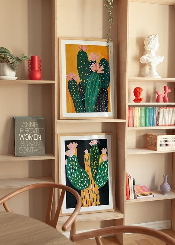 Colorful cactus blossom against a warm orange background spreads joy-12