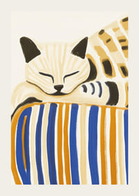 En avslappnad katt vilar på en randig kudde, sprider lugn och harmoni-3