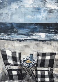 Two chairs by the sea in an idyllic coastal scene-7