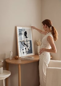 An elegant figure in black and white reads in silence-8
