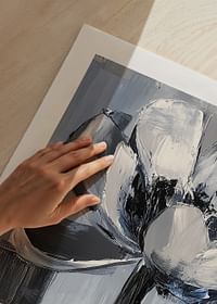 The flower floats in soothing blue and gray tones-5